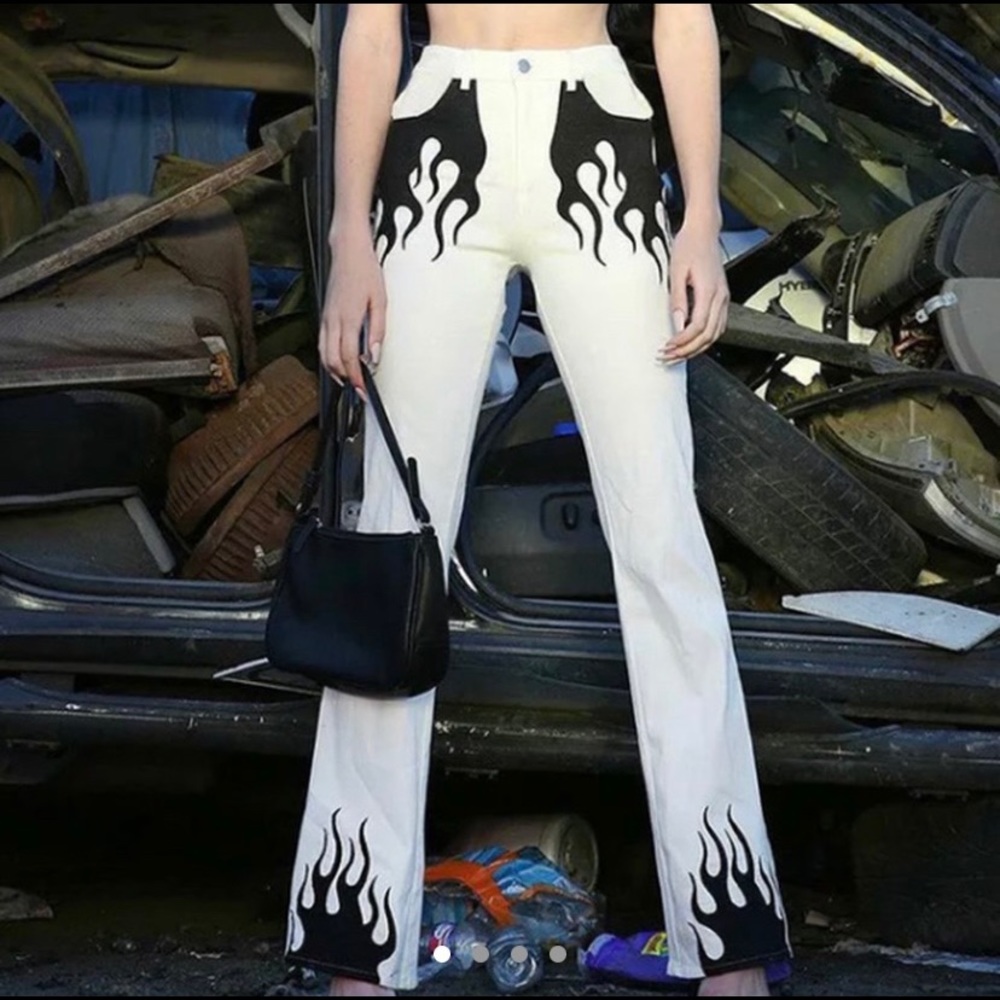 White jeans with black flame detail